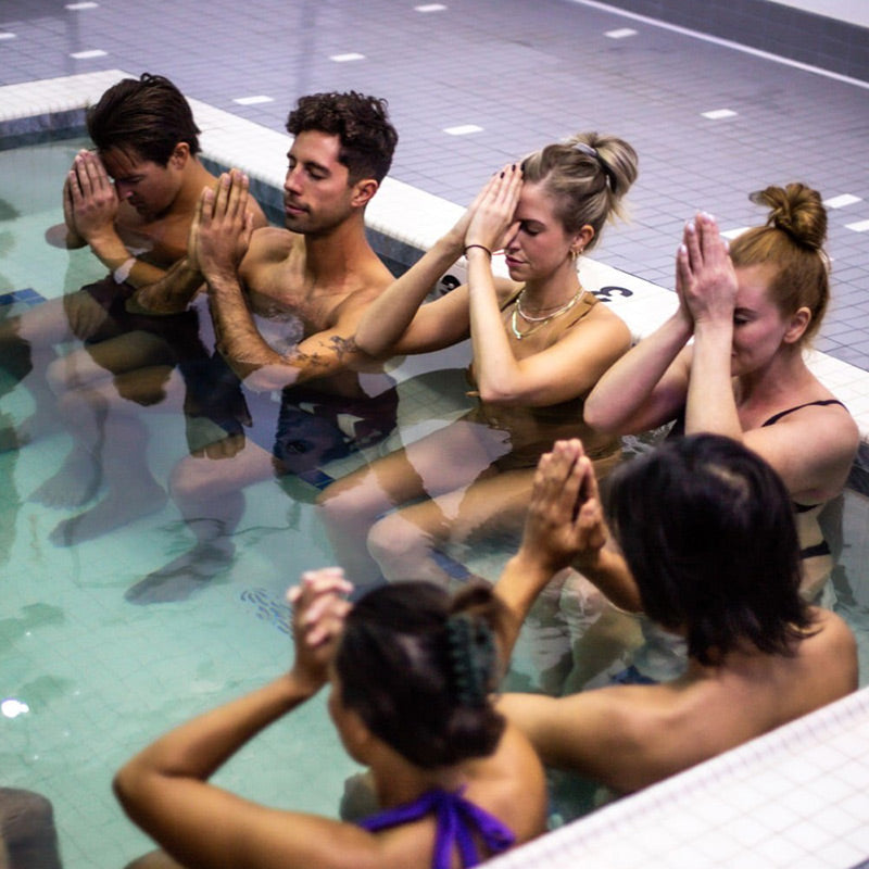 Image of a group of people taking a cold plunge at the breathe degrees studio 