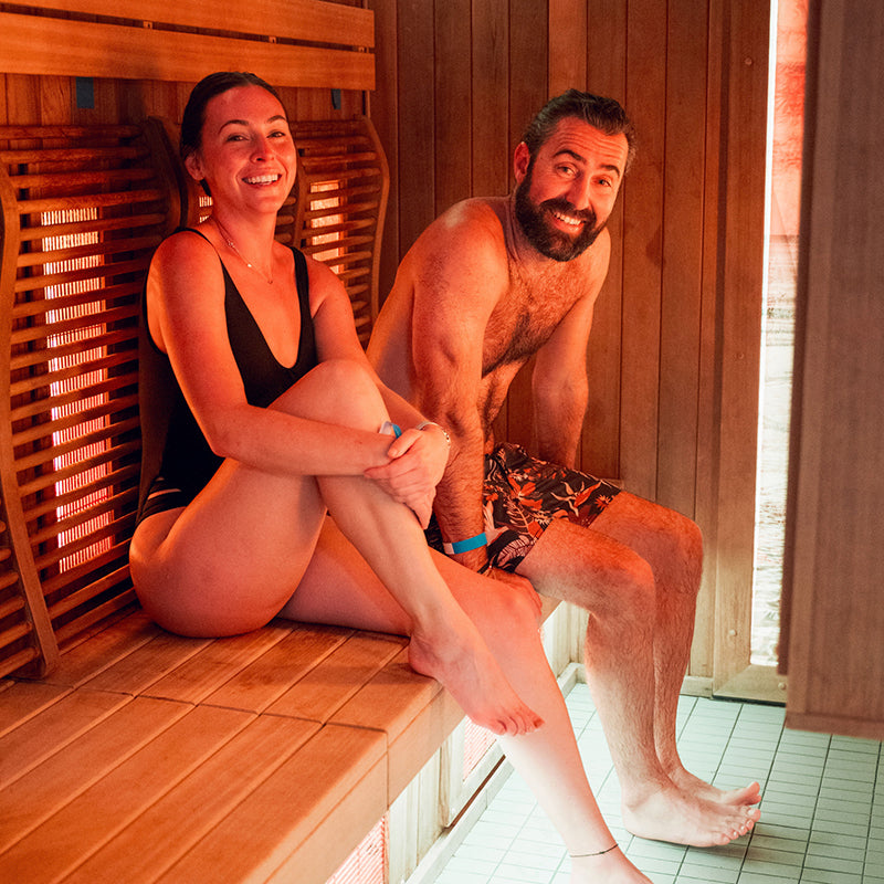 Two people enjoying a sauna at Breathe Degrees